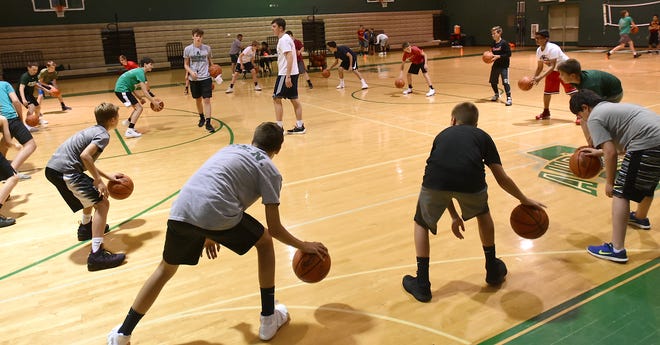 Campers work on dribbling drills at the Aurora boys basketball camp on Monday, June 11. Kevin Graff, Record-Courier MyTownNEO.com