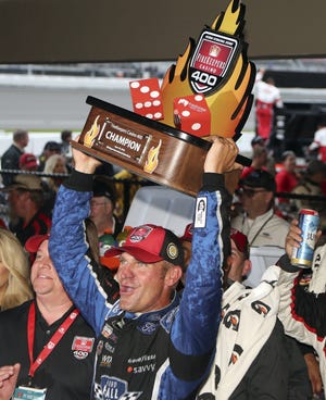 Clint Bowyer took only two tires on a late pit stop, and that strategy by his crew chief proved to be the race-winning move when rain ended the Firekeepers Casino 400 on Sunday at Michigan International Speedway. The win was the second of the season for Bowyer and 10th of his career, and Stewart-Haas Racing enjoyed a podium sweep with Kevin Harvick finishing second and Kurt Busch third. [AP Photo/Carlos Osorio]