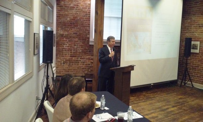 N.C. Gov. Roy Cooper met with local government officials and business leaders Tuesday morning at Community Arts Council as part of his Hometown Strong initiative to strengthen rural communities. [Eddie Fitzgerald/The Free Press]