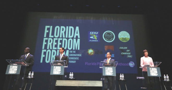 From left, Tallahassee Mayor Andrew Gillum, businessman Chris King, Miami Beach Mayor Philip Levine and U.S. Rep. Gwen Graham listen to the moderators during Monday's gubernatorial debate ahead of the Democratic primary for governor. [AP Photo/Brynn Anderson, Pool]