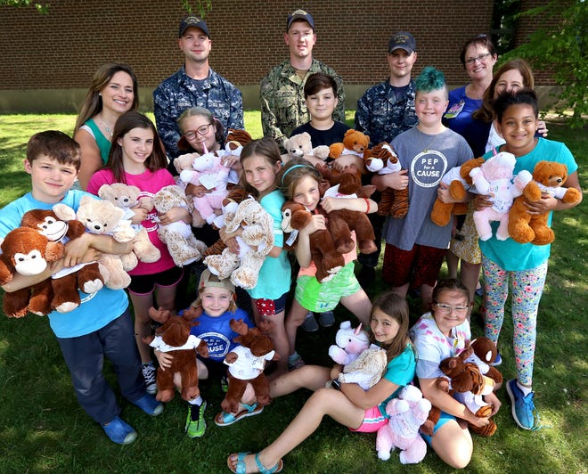 Little Harbour School students in the PEP for a Cause program spent the last six weeks crafting teddy bears for sick children at Portsmouth Regional Hospital, writing letters to the elderly at Edgewood Centre and to members of the armed services. The kids gathered Tuesday to pass on their projects to staff from the hospital and sailors at Portsmouth Naval Shipyard.[Ioanna Raptis/Seacoastonline]