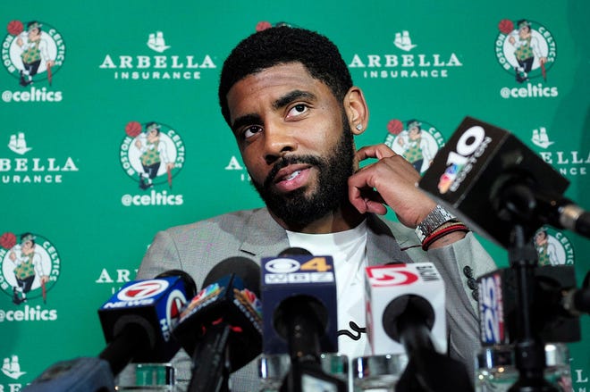 Kyrie Irving meets the media in Boston on Tuesday.