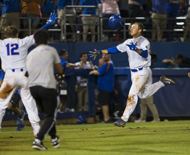 Florida left fielder Austin Langworthy heads for home after hitting a game-winning solo home run in the 11th inning Monday night to help the Gators beat Auburn 3-2 to win the Gainesville Super Regional at McKethan Stadium and advance to the College World Series. [Photo by Cyndi Chambers]