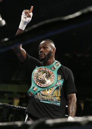 Deontay "Bronze Bomber" Wilder holds up his hand, signaling "No. 1," with the World Boxing Council Heavyweight title belt around his shoulder following the 12-round World Boxing Council Heavyweight Championship match against Gerald "El Gallo Negro" Washington at the Legacy Arena at the Birmingham-Jefferson Civic Center on Feb. 25, 2017. [File Staff Photo/Erin Nelson]