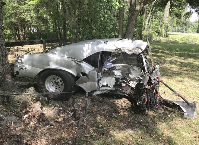 A Camaro was broken into pieces when it hit a tree beside County Road 316 on the morning of April 21. A 44-year-old Ocala man was killed in the crash. [Austin L. Miller/Staff/File]