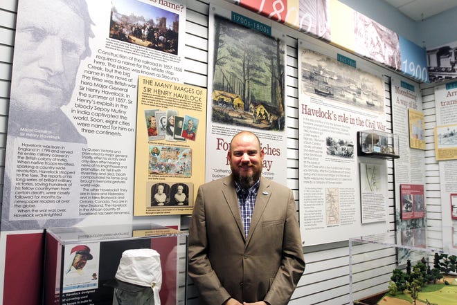 Havelock Mayor Will Lewis stands amid the Havelock historical display inside the Havelock Tourist and Event Center. Lewis is serving his second term as mayor of Havelock. [KEN BUDAY / GATEHOUSE MEDIA]