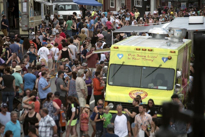 Food and beer lovers pack the streets of downtown Somersworth for the Seacoast Food Truck and Craft Beer Festival last Sunday. [John Huff/Fosters.com]