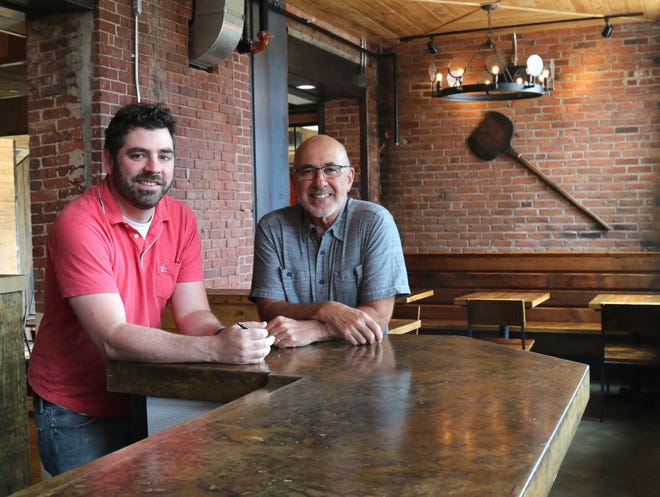 Michael Cavaretta, left, and his uncle John Cavaretta recently opened Cornerstone Artisanal Pizza & Craft Beer in the Frank Jones Brew Yard in Portsmouth's West End. [Suzanne Laurent photo]