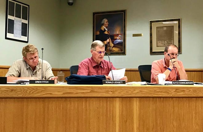Kittery Planning Board members, from left, Drew Fitch, Ronald Ledgett and Dutch Dunkelberger discuss a proposal to rezone the town's business park Thursday night. [Hadley Barndollar/Seacoastonline]