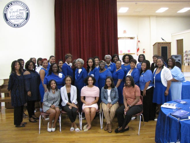 The Delta Sigma Zeta chapter of Zeta Phi Beta Sorority Inc., in background, honored five high school graduates, front, from left, Jessica McKay, Alaysha Cash, Keoni Reid, Janai McDaniel, and Shaniah Flanders, with scholarships during the 2018 annual Scholarship and Community Awards Luncheon. [Aida Mallard/Special to the Guardian]
