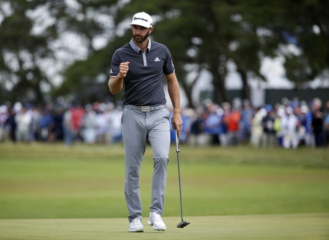 Dustin Johnson reacts after making a putt for birdie on the fourth green during the second round of the U.S. Open on Friday in Southampton, N.Y. [Seth Wenig/The Associated Press]