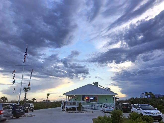 Right off of A1A, Commander's Shellfish Camp offers outside patio dining complete with cool breezes and colorful sunsets. [Photo by Caron Streibich]