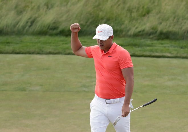 Brooks Koepka reacts after sinking a putt on the 14th green during the third round of the U.S. Open on Saturday in Southampton, N.Y. [Julio Cortez/The Associated Press]