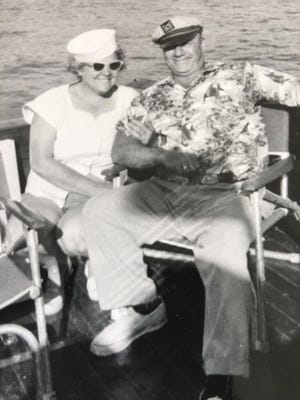 Arthur Folco and his wife, Ora Folco, on one of their earlier boats. Photo likely taken in the late 1950s or early 1960s. [FOLCO FAMILY]