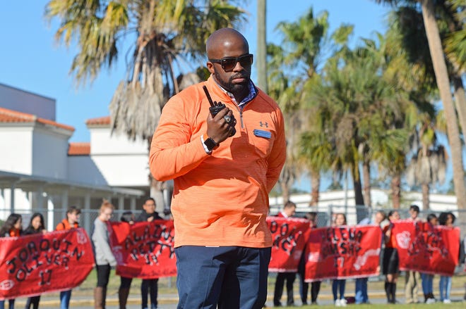 Leesburg High School Principal Michael Randolph guides students during the walkout to honor the 17 people killed at Marjory Stoneman Douglas on March 14 in Leesburg. Last week, the Lake County School Board approved a restricted version of the guardian program on school campuses in the fall. [Whitney Lehnecker/Daily Commercial]