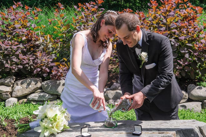 Utilizing sand in wedding rituals can be a way to incorporate earthen elements into your big day. [GARTH WOODS PHOTO]