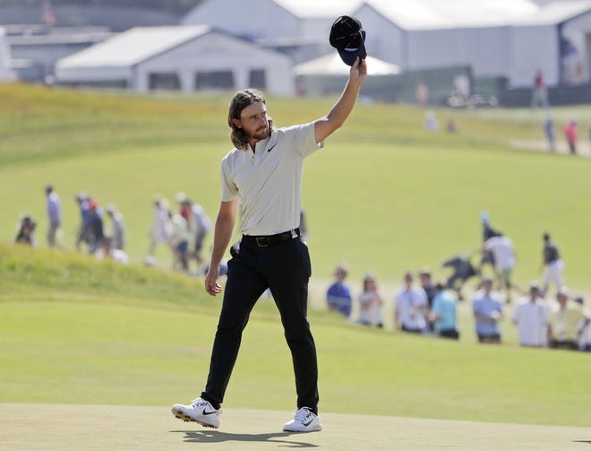 Tommy Fleetwood, of England, waves to spectators Sunday after finishing the final round of the U.S. Open Golf Championship with a 63, finishing second to defending champion Brooks Koepka. [Frank Franklin II/The Associated Press]