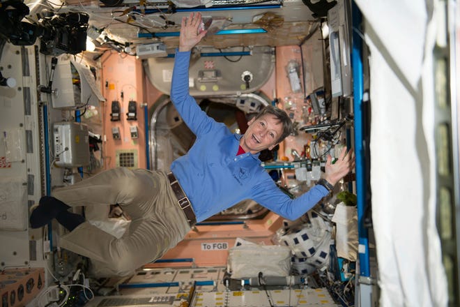 In this Nov. 28, 2016, photo made available by NASA, astronaut Peggy Whitson floats through the Unity module aboard the International Space Station. She retired Friday. [NASA VIA AP]