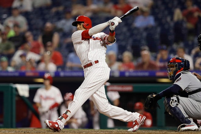 The Phillies' Aaron Altherr hits a game-winning two-run double off Cardinals relief pitcher Matt Bowman during the 10th inning Monday. [MATT SLOCUM/THE ASSOCIATED PRESS]