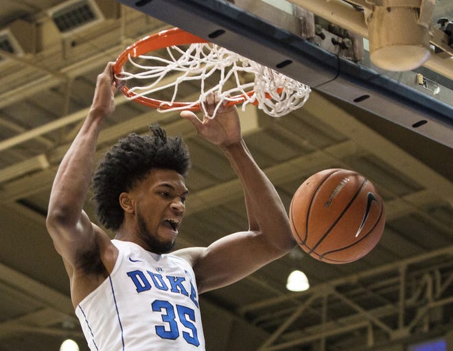 In this Jan. 27 photo, Duke's Marvin Bagley III dunks against Virginia during the first half of a college basketball game in Durham, N.C. Bagley is a possible No. 1 overall pick and double-double machine with a long frame. [AP PHOTO/BEN MCKEOWN]