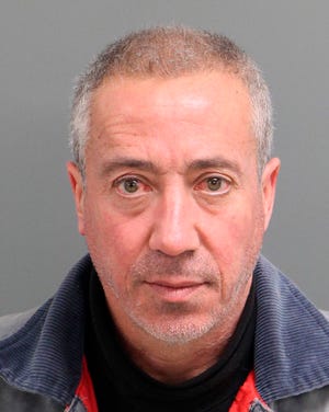 FILE - This undated file mug shot provided by the Wake City-County Bureau of Identification shows Christian Desgroux, 57, who's accused of pretending to be a U.S. Army general when he landed a chartered helicopter at a technology company in North Carolina in November 2017. His defense attorney, Andrew McCoppin, wrote in a court filing Thursday, June 14, 2018 that his client plans to plead guilty and he won’t object to a conclusion that he was sane at the time of the crime. (Wake City-County Bureau of Identification via AP, File)