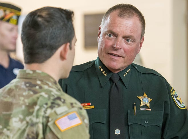 Lake County Sheriff Peyton Grinnell is pictured at an event. Area cities are not as gung ho as they appeared to be several weeks ago about helping bear the cost of stationing police officers in area schools. [DAILY COMMERCIAL FILE]