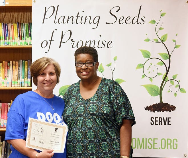 Theresa Williams of the regional nonprofit Young Women of Promise, right, and Pink Hill Elementary School teacher Brenda Griffin teamed up for the Planting Seeds of Promise initiative, which turned grant awards into a vegetable garden and lessons on the impact of hunger and the benefits of volunteerism. [Submitted photo]