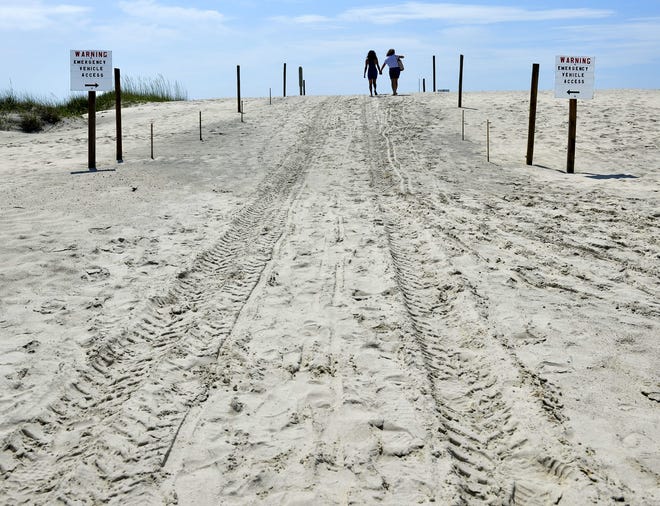 A breach in the dunes on 19th Street allowed damaging waters during Hurricane Mathew. Since then, a giant sandbag made out of polypropylene that is now sturdy enough for vehicles has helped repair the breach. [Steve Bisson/savanahnow.com]