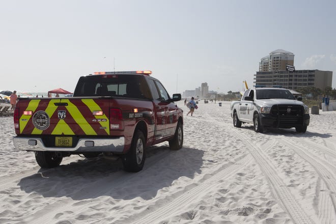 Bay County Sheriff’s Office and EMS personnel respond to a drowning in front of the Dunes of Panama, 7205 Thomas Drive, Tuesday afternoon. Witnesses said the 60-year-old man was not responsive when he was pulled from the water. [JOSHUA BOUCHER/THE NEWS HERALD]