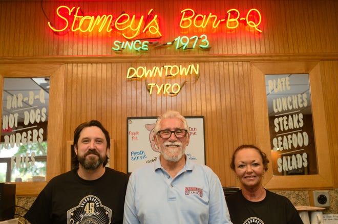 Stamey's Barbecue on N.C. Highway 150 in Tyro recently celebrated its 45th anniversary. Pictured from left are manager Matt Stamey, owner Dan Stamey and longtime waitress Elaine Moody. [Ben Coley/The Dispatch]