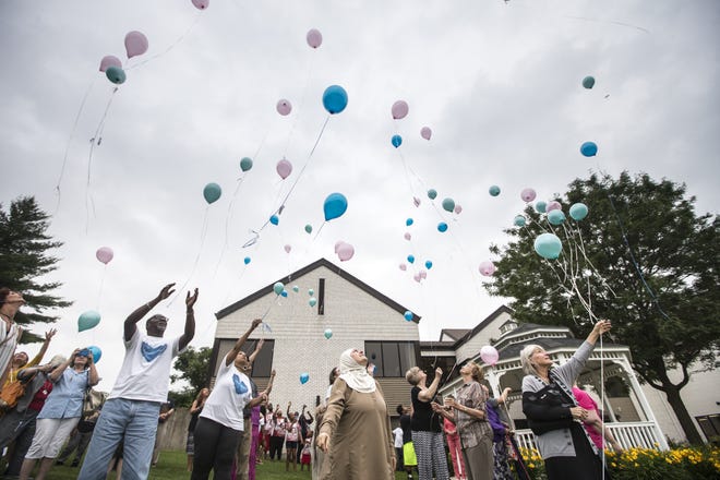 Family members of homicide victims release memorial balloons during the 13th annual Carol McFeggan Homicide Victim Memorial Service on Wednesday, June 20, 2018, at Riverside Community Church in Machesney Park. [SCOTT P. YATES/RRSTAR.COM STAFF]