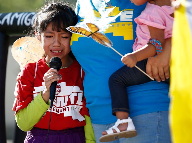 Akemi Vargas, 8, cries as she talks about being separated from her father during a protest Monday in Phoenix. [AP Photo/Ross D. Franklin]