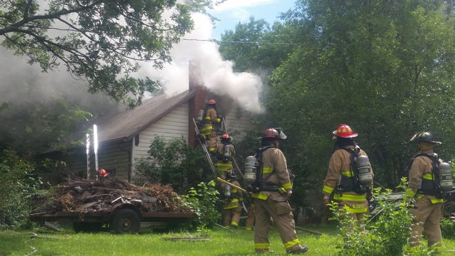 A fire was reported at 4:03 p.m. Wednesday in the 1000 block of N.E. Monroe. [Tim Hrenchir/The Capital-Journal]