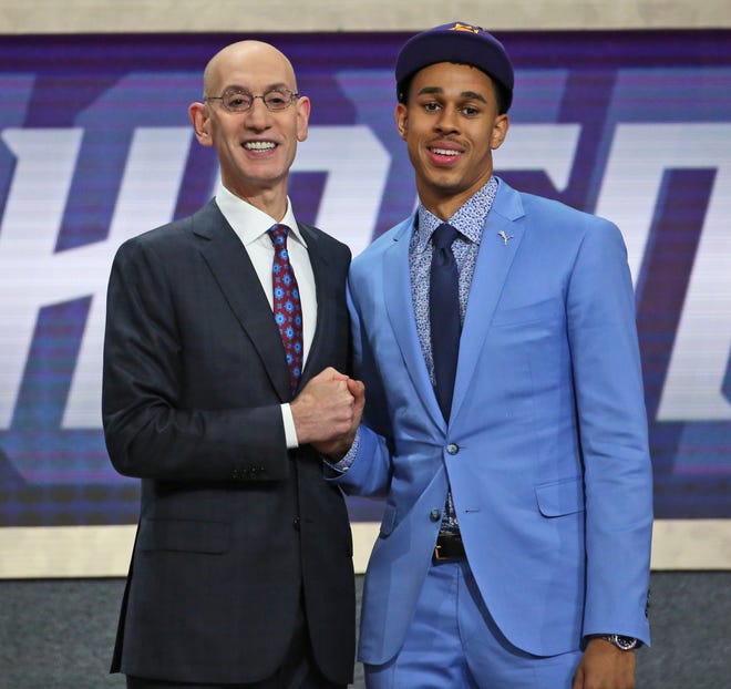 Texas Tech's Zhaire Smith, right, poses with NBA Commissioner Adam Silver after he was picked 16th overall by the Phoenix Suns on Thursday. The Sixers traded Mikal Bridges, the 10th overall pick, to the Suns for Smith in a swap of first-round draft picks. [KEVIN HAGEN/THE ASSOCIATED PRESS]