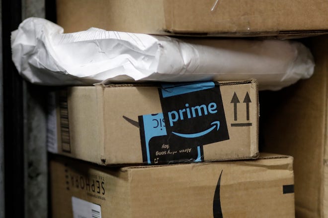 A package from Amazon Prime is loaded for delivery on a UPS truck in New York. A U.S. Supreme Court decision expanding the ability of states to pull in tax dollars from online purchases could have a significant impact in Florida. [Mark Lennihan/AP File]