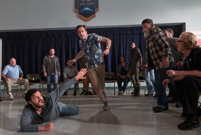 Jake Johnson, on floor, and Ed Helms, center, star in "Tag." [WARNER BROS.]
