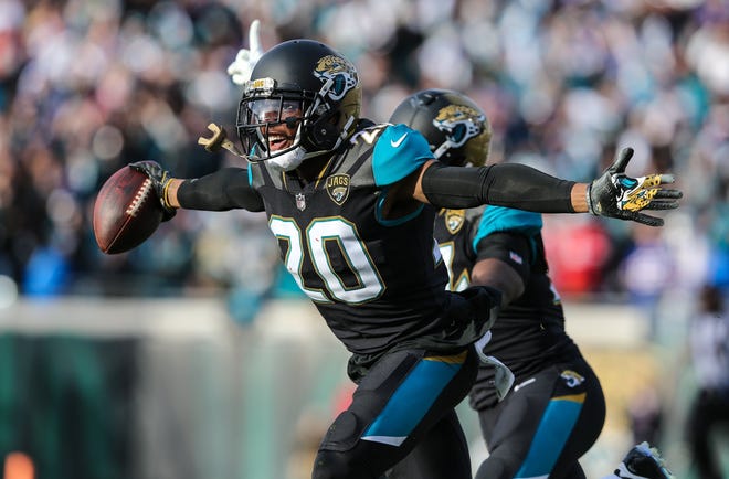 Jaguars cornerback Jalen Ramsey (20) runs down the field in celebration after intercepting a pass against Buffalo in the AFC playoffs. [For The Florida Times-Union/Gary Lloyd McCullough]