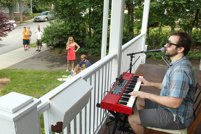 Drunken Logic pianist Jake Cassman sings Billy Joel's "Piano Man". Quincy's annual Porchfest features a variety of music and crowds throughout the city's neighborhoods, Saturday, June 24, 2017.

Gary Higgins/The Patriot Ledger