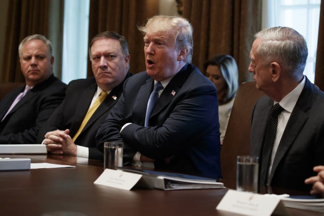 President Donald Trump speaks during a cabinet meeting at the White House, Thursday, June 21, 2018, in Washington. From left, Deputy Secretary of Interior David Bernhardt, Secretary of State Mike Pompeo, Trump, and Secretary of Defense Jim Mattis. (AP Photo/Evan Vucci)