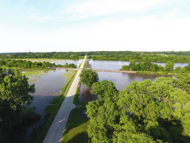 The Skunk River flowed over its banks into farmland surrounding Cambridge Thursday, June 14, after storms dumped close to 5 inches of rain in the morning. This view is County Road E63 headed east out of Cambridge. Photos courtesy of Cambridge resident Brent Hilgenberg