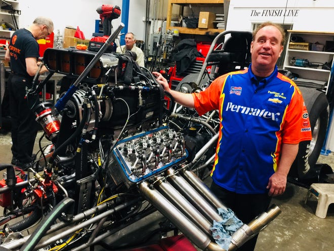 Jay Blake with Follow A Dream Team's Top Alcohol Funny Car, which has an 8-cylinder engine with over 4,000 horsepower. (BP photo/Bronwen Howells Walsh)