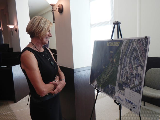 Council member Diane Travis takes in the Bell Ceramics conceptual boat ramp plan, prior to Tuesday's council workshop in Clermont. [LINDA CHARLTON / CORRESPONDENT]