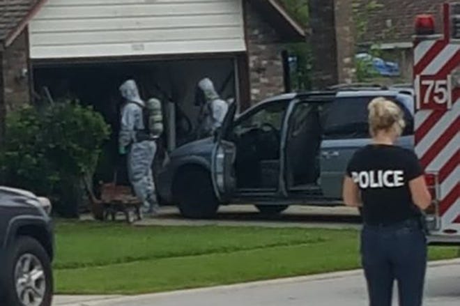Police respond to a Port Orange home Friday where they say meth making materials were found. [Submitted photo]