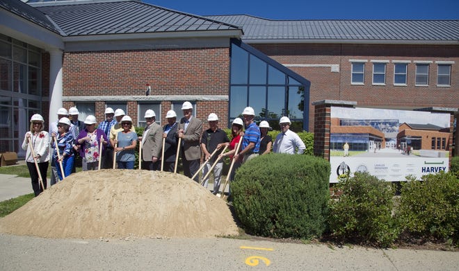 Officials and dignitaries break ground on the expansion and renovation project of the R.W. Creteau Regional Technology Center in Rochester. [John Huff/Fosters.com]