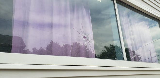 A bullet hole in a window at an apartment on Pine Street caused by Friday's early morning shooting. [Herald News Photo | Brian Fraga]