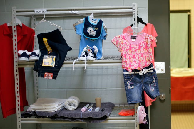 FILE - In this July 31, 2014, file photo, new clothess and other personal items are seen at the Karnes County Residential Center in Karnes City, Texas. The immigration detention facility has been retooled to house adults with children who have been apprehended at the border. The Trump administration is calling for the expanded use of family detention for immigrant parents and children who are stopped along U.S.-Mexico border, a move described by advocates as a cruel and ineffective attempt to deter families from coming to the United States. (AP Photo/Eric Gay, File)