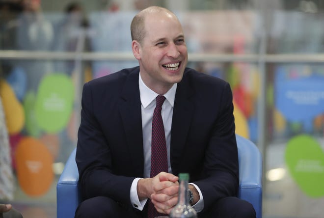 In this Jan. 18, 2018 file photo, Britain's Prince William, laughs while with military veterans now working for the National Health Service as he visits Evelina London Children's Hospital in London. [AP Photo/Daniel Leal Olivas, Pool]