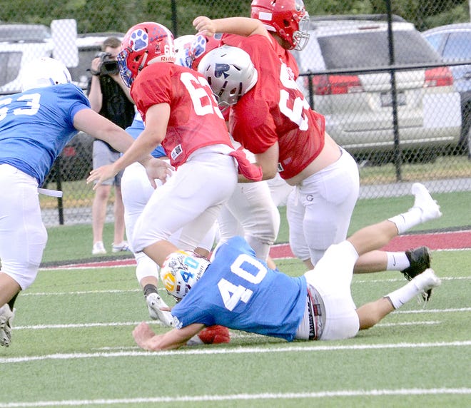 John Glenn High's Nick Meinert (40) assists with a tackle during the Muskingum versus Licking All-Star game at White Field in Newark Friday Night.