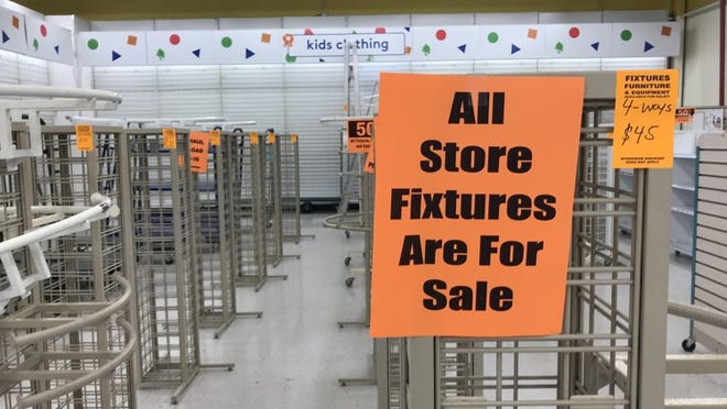 Shelves that were once teeming with toys are abandoned and empty inside Toys R Us store in Palm Beach Gardens (Larry Aydlette/The Palm Beach Post)