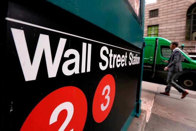 In this April 5, 2018, file photo, a sign for a Wall Street subway station is shown in New York. The U.S. stock market opens at 9:30 a.m. EDT on Monday, June 25. (AP Photo/Richard Drew, File)